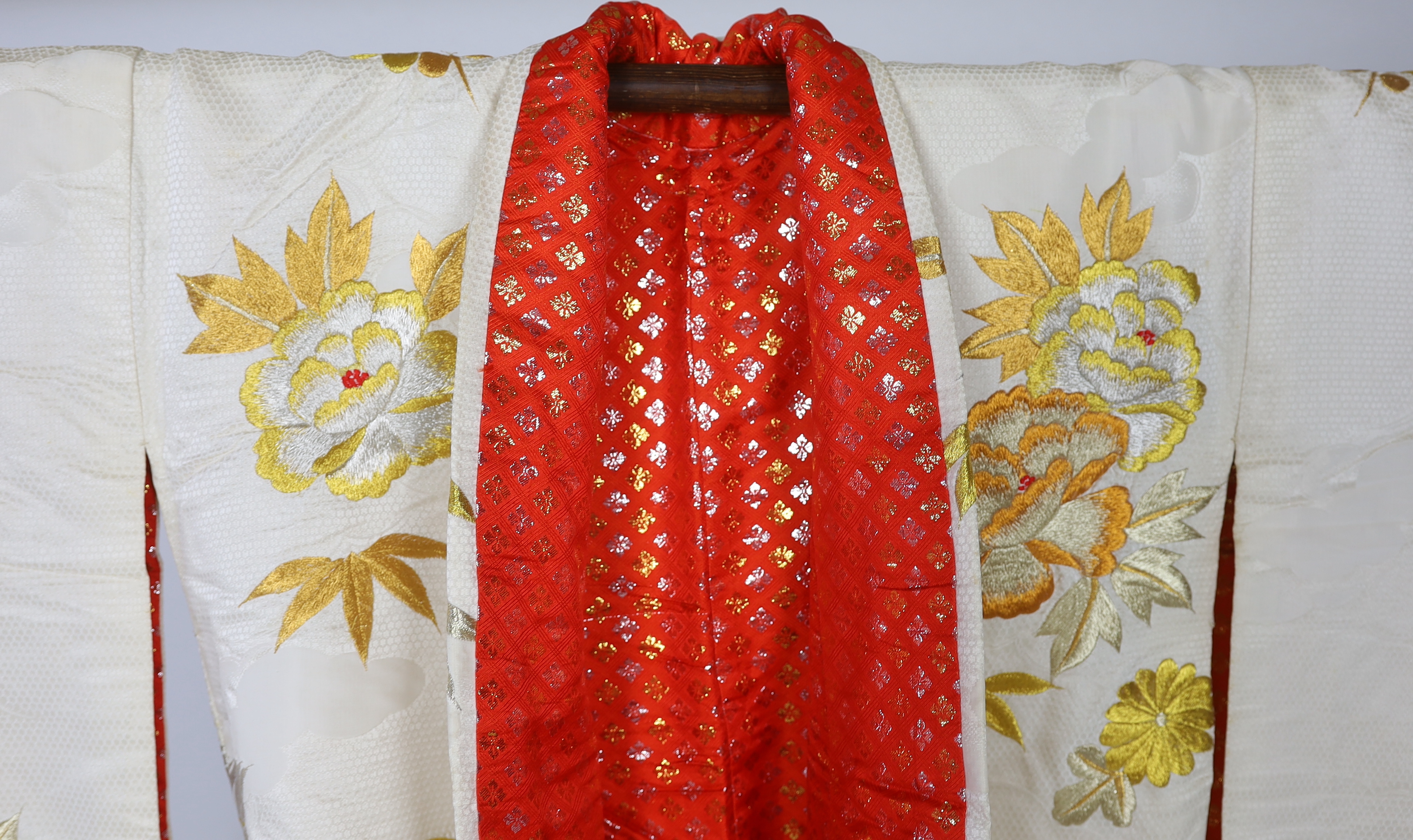 A 1960s-70s vintage Japanese embroidered wedding kimono, embroidered with pewter, bronze, silver and gold coloured metallic threads, into a large decorative design of peacocks with fanned tail feathers and trailing flowe